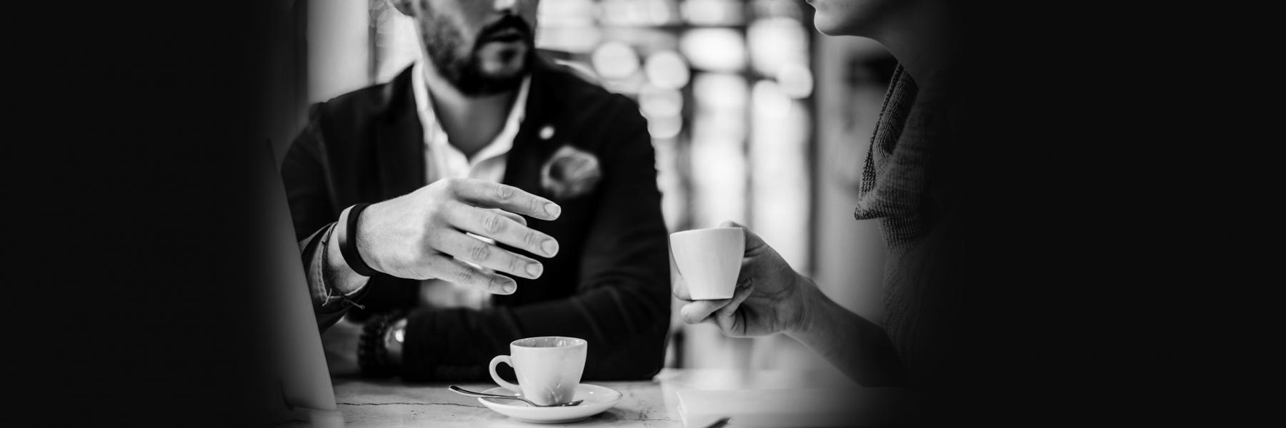 An image of a business meeting over coffee